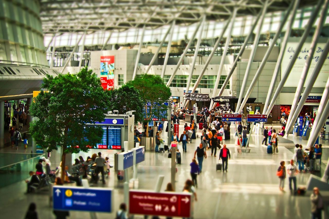 A busy international terminal on a travel day, where the arrival process starts