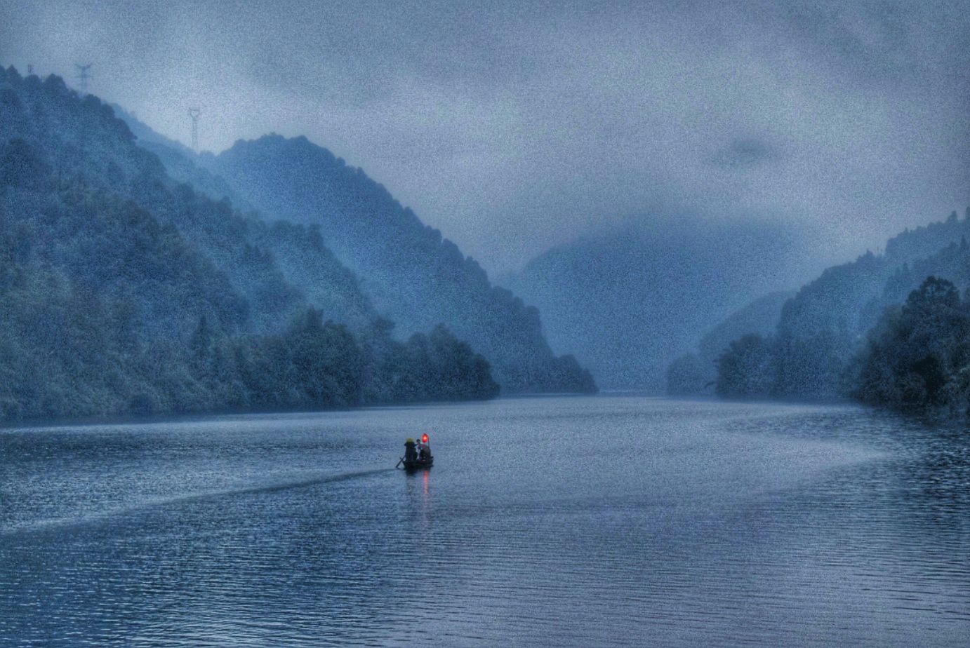 Morning mist over the Xiaodongjiang section of Dongjiang Lake