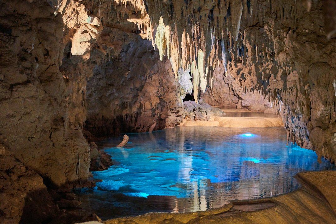 Illuminated stalactites inside Huanglong Cave, which holds 16°C year-round