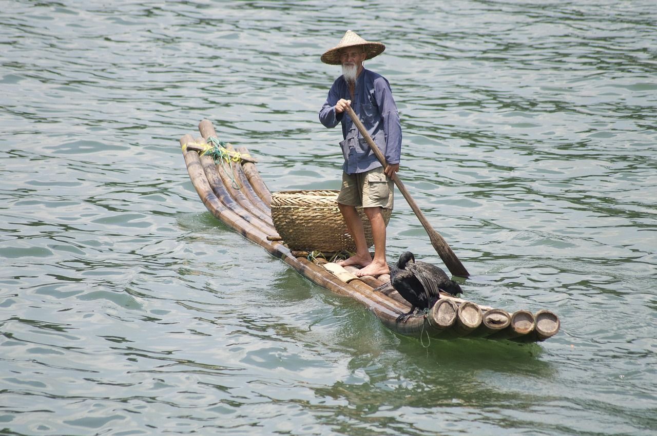 A cormorant fisherman on the Li River — the classic evening scene
