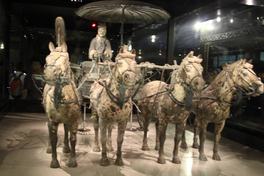 The Qin Shihuang bronze chariot on display at the Terracotta Army museum near Xi'an: four bronze horses, a bronze charioteer and an umbrella canopy